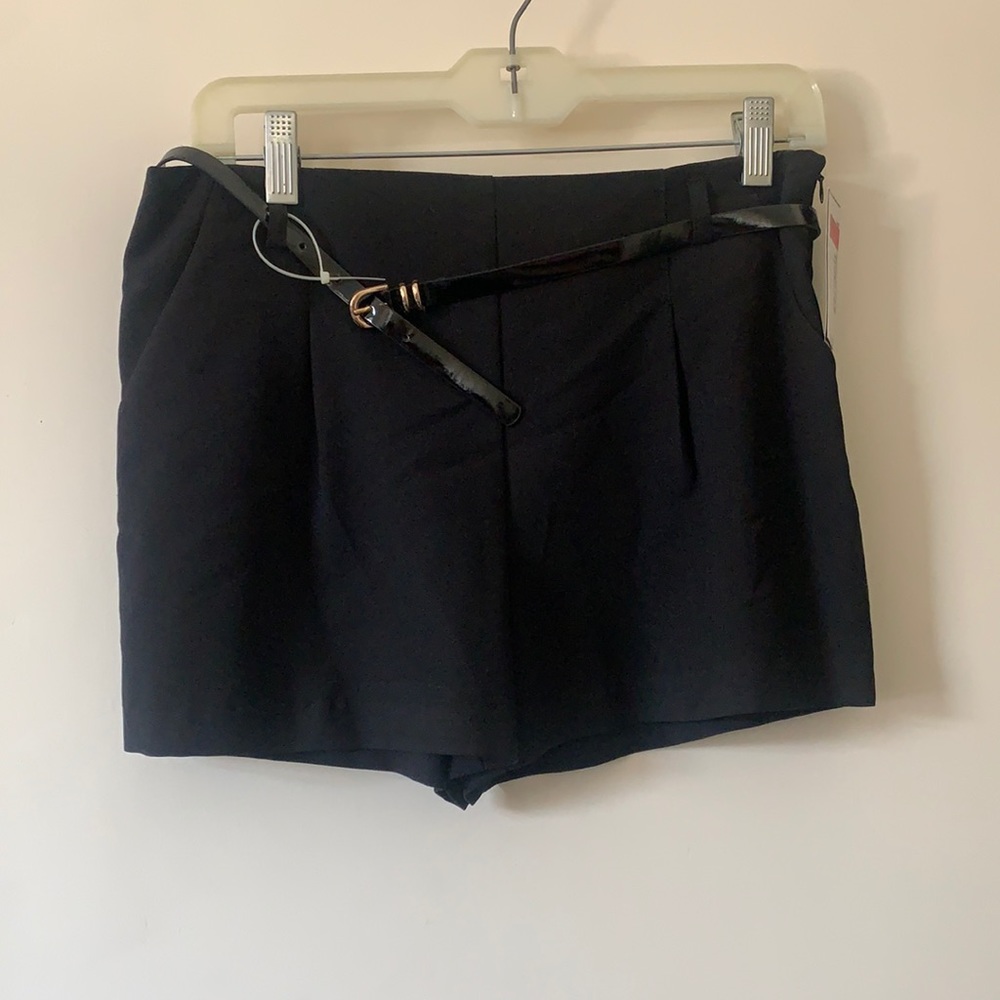 Black shorts with a black belt, size 7.